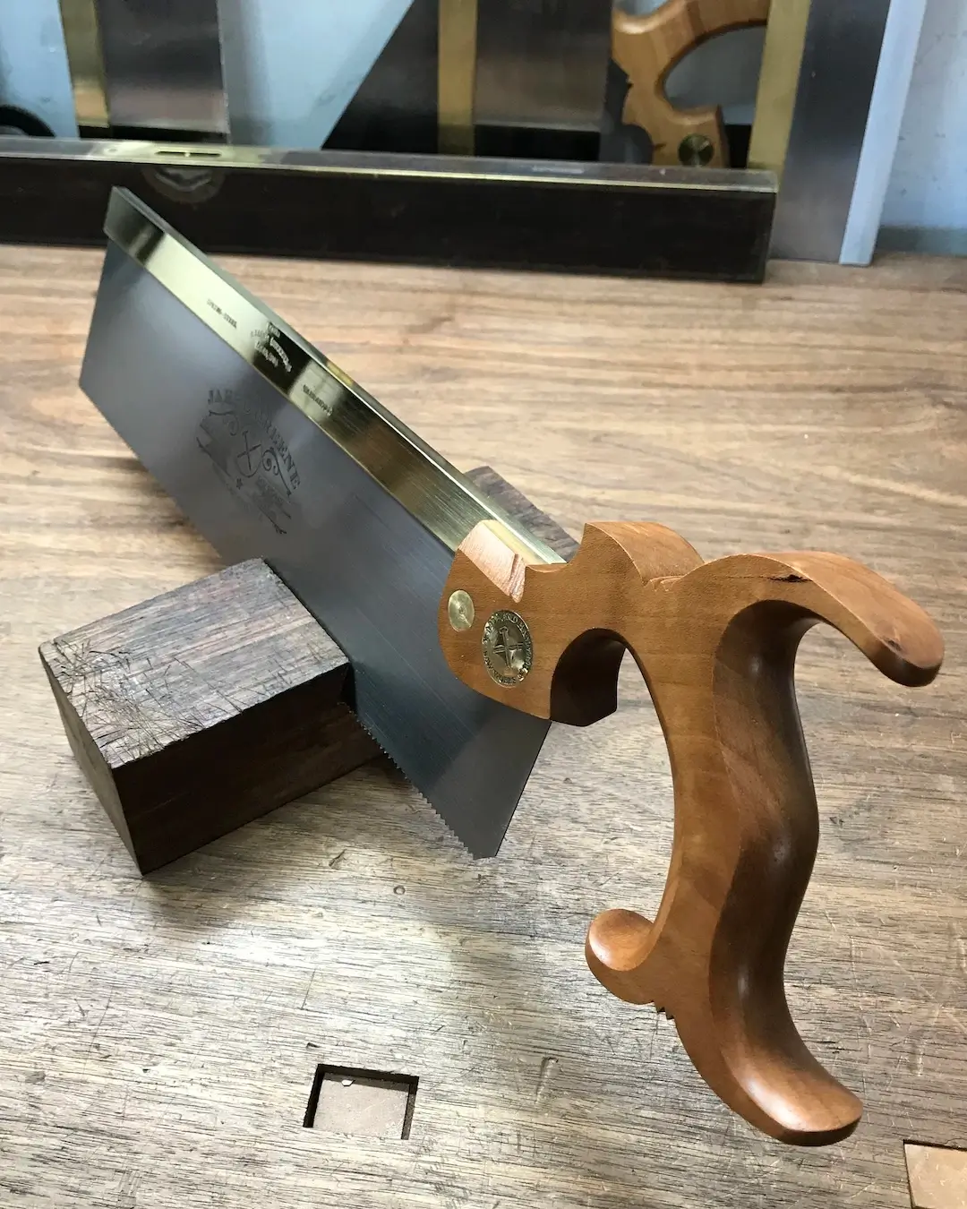 A twelve inch carcass saw with my standard handle in cherry wood.